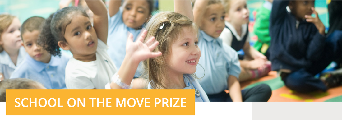 Children raising their hands in a classroom, in a School on the Move campaign image